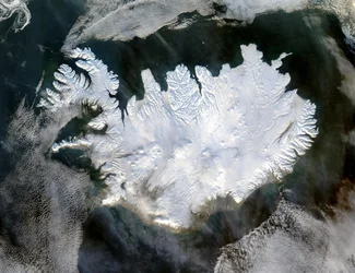 Satellite image of Iceland on 28 January 2004 showing it covered in a blanket of snow and ice which is obscuring the permanent glaciers and icecaps that exist year-round
